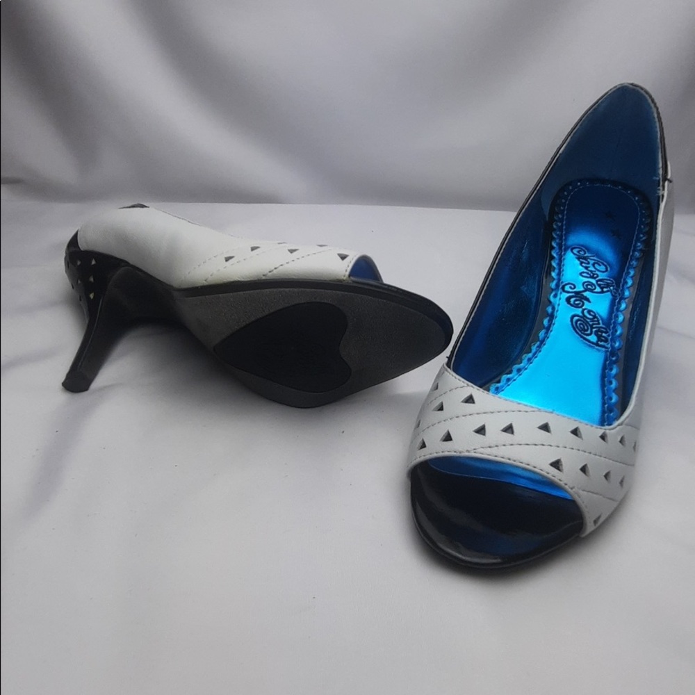 Black and white peep toe pumps